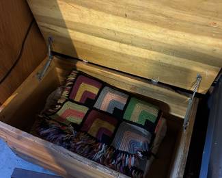 Cedar chest and linens....