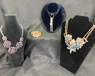 Costume Jewelry Assortment Featuring Necklaces and a Bracelet