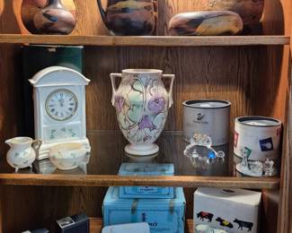 Royal Haeger, Roseville Pottery with tag, Belleek, Swarovski, Lladro, Wedgewood, and Cow Parade Moonwalk.