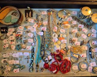 Sterling, Turquoise, Coral, Abalone and Mother of Pearl.