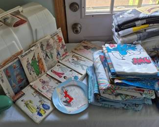 Sewing machine, vintage buttonholer, vintage clothing patterns. The vintage towels and bedding include: Garfield, Masters of The Universe, Smurfs, Mickey Mouse, Sesame Street, Mulan, E.T., and United States Army...HOOAH!