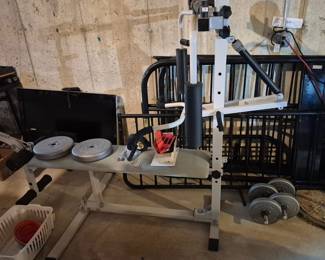 Workout equipment. Twin bunk bed and TV in backround.