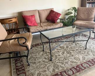 4 piece indoor/outdoor conversation group, including loveseat, 2 chairs and glass-topped table.