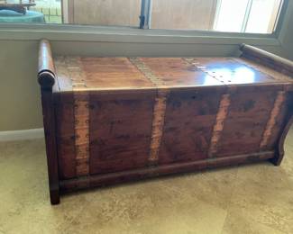 Unique wooden chest with copper accents.