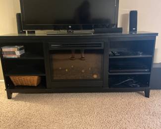 TV console with remote-controlled electric fireplace.