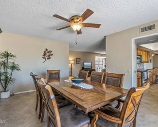 Stunning solid wood dining room table with 2 armchairs, 6 side chairs and 2 leaves, which gives dimensions of 110” x 44”.