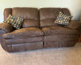 Couch with reclining on both ends.