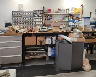 Workbench in garage with very organized hardware