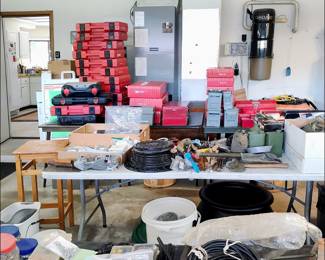 Garage Items. The red things stacked in the background are empty HILTI tool cases. Next to them are lots of other toolboxes and storage containers.