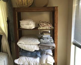 Shelves, linens, lampshade, pillows