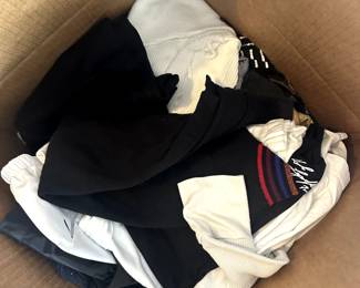 boxes of clothes (women's designer, mid-tier designer, and lower)