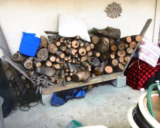 Rack of oak fireplace wood guessing near a 1/4 cord seasoned.as