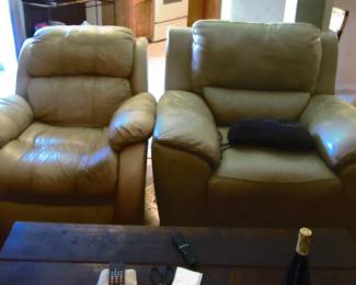 Leather chairs on left is rocker and on right is recliner, very comfortable and in good condition.
