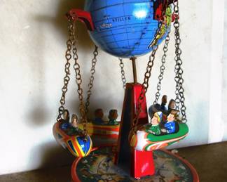 Vintage tin litho Globe Carousel or Flight around the world, produced in Germany circa 1950 by German Josef Wagner. Item is near perfect and works great. We do NOT have the original box. Very collectible.