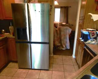 Working stainless steel two door refrigerator.