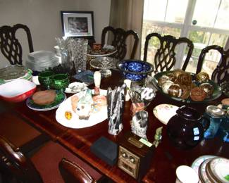 Misc and collectible glassware and others. dinning table and ten matching chairs.