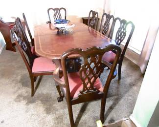 Duncan Phyfe table with 3 Leafs and pad. 10 not matching dining chairs.