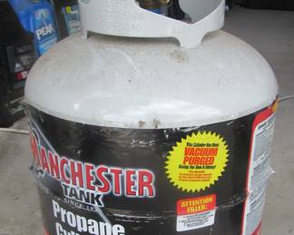 One of ten (10) full propane bottles.