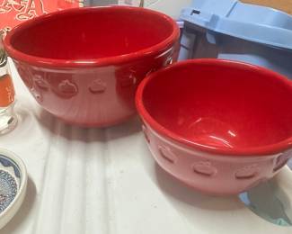 Two red mixing bowls 