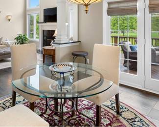 This glass 48 in table with rod iron base is also perfect seating for four!