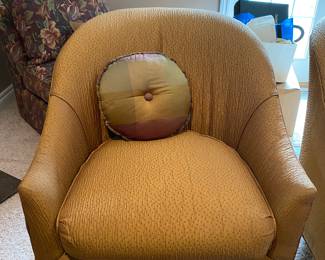 A pair of these side chairs in golden tan fabric with pillows.$100; (some stains on cushion need to be cleaned)