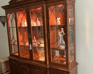 This is a stunning mahogany solid furniture piece by Henredon. It comes with glass doors, interior deck lights, three lower drawers, and adjustable side shelves. All doors are lockable with a provided tasseled key. $1500.