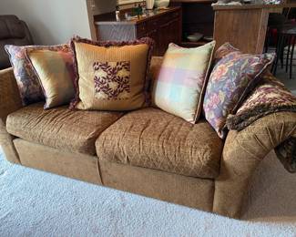 Soft dark brown sofa with patterned pillows and throw to match! $100