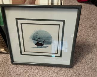 Framed art titled “ Friendly Pair” by artist P. Buckley, featuring two Canada geese in a winter landscape. $150