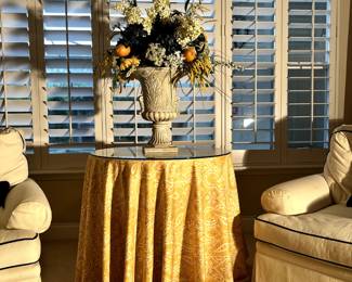Living room table with glass top.