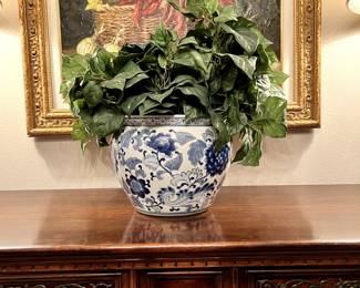 Faux plant with blue planter