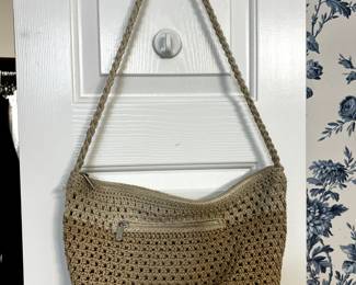 Two rooms have a variety of purses