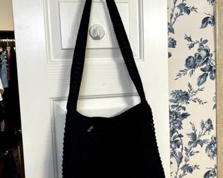 Two rooms have a variety of purses