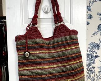 Two rooms have a variety of purses