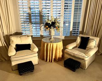 Living room chairs and foot stools.