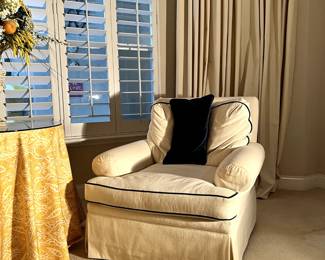 Living room chairs and foot stools.