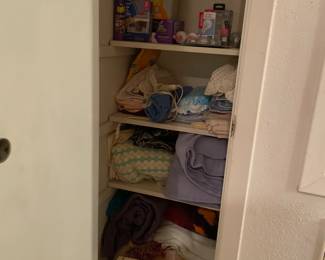 Another closet with sewing machine and notions