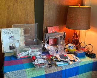 Singer 301a sewing machine with case, pedal, buttonholer and accessories.
Sewing supplies
