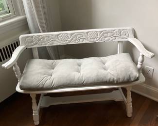 White carved bench with grey cushion