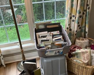 Assorted frames and material and bolts of vintage fabrics