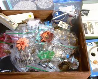 Costume jewelry located near fire place.