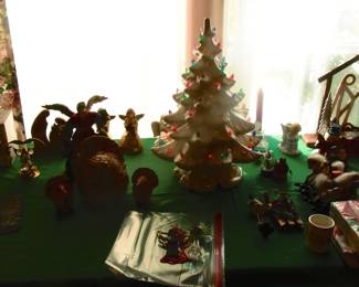 Table full of collectible Christmas items.