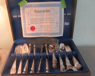 Set number two, plated flatware in box.