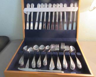 One of two flatware sets, plated silverware.