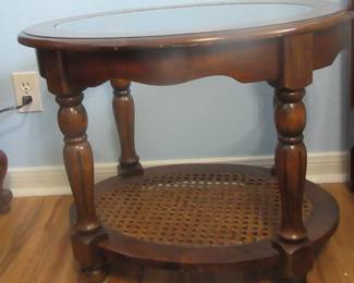 One of two glass topped end tables.