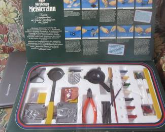 Inside Vintage Neister Zinn by Nuernberger bpx. The English meaning is that this toy is for making lead soldiers. All instructions and box are in German,