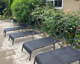 4 Metal Lawn Lounging Chairs, good condition no rips or tears.
