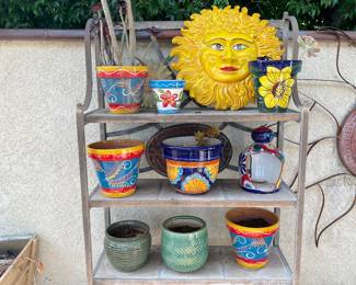These is an example of the colorful pots, the shelving unit one of a pair is also included in this sale.