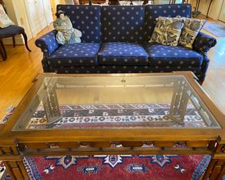 Sofa, glass top coffee table, rug