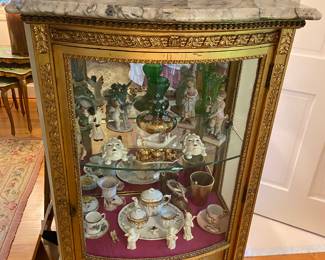 Antique Louis XVI style with marble top curio cabinet from the homeowner’s aunt in Baltimore