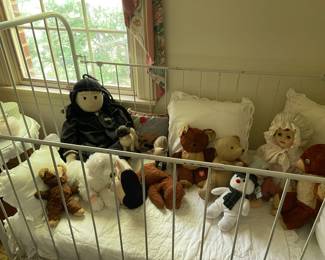 Antique painted wrought iron crib, was used when the homeowner’s father as a child in the early 1900’s